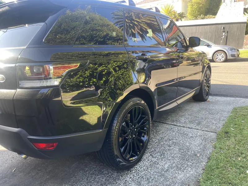 Black SUV paint after a wash and sealant