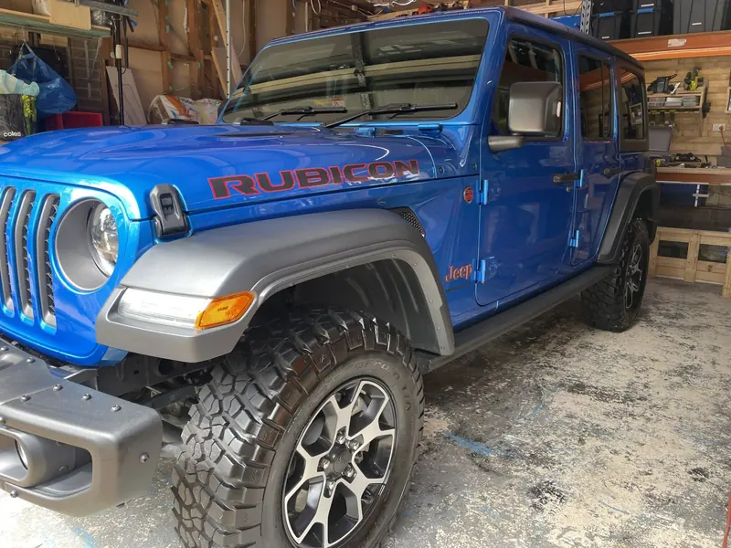 Blue Jeep Wrangler with a glossy finish