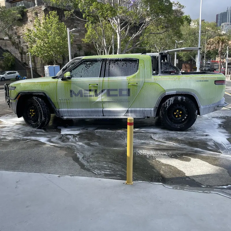 Sign-written fleet ute being washed