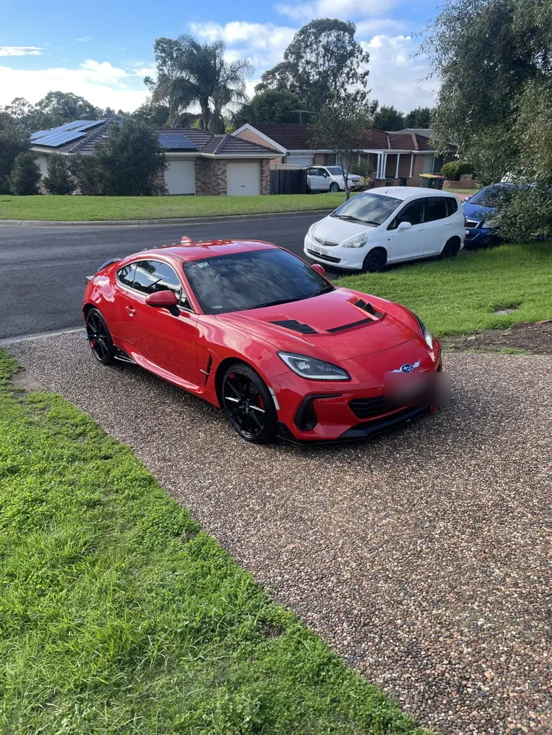 Red sports coupe with a polished finish