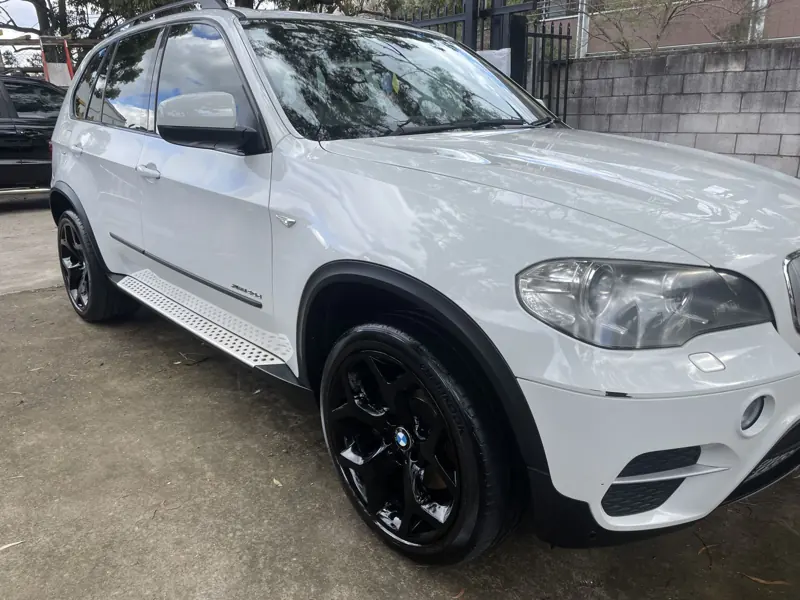 White BMW X5 with a glossy finish
